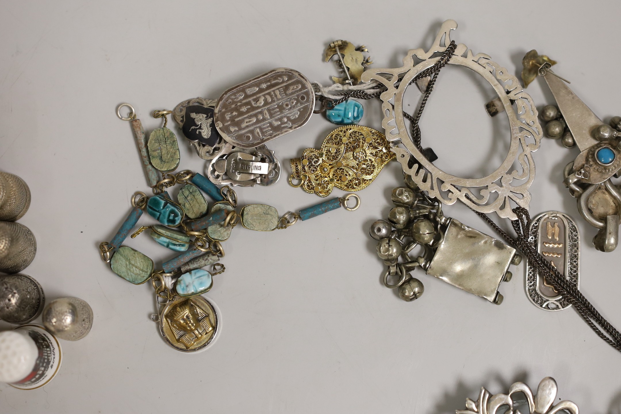 A quantity of scarab beetle style jewellery, silver frames, various thimbles etc.